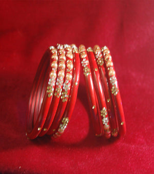 Red coloured fancy broad glass bangles