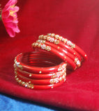 Red coloured fancy broad glass bangles