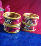 Red and yellow coloured lac bangle with beautiful design