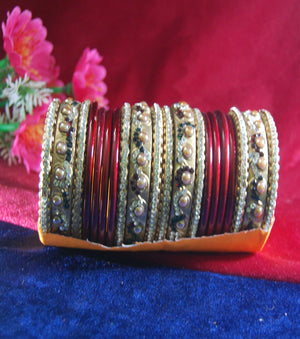 Maroon and golden coloured lac bangle beautifully designed with stones