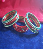 Red and green coloured lac bangle studded with nag set
