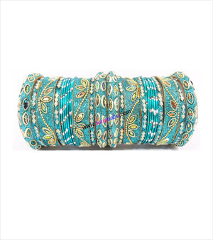 Magenta coloured chura set with designer broad kangans