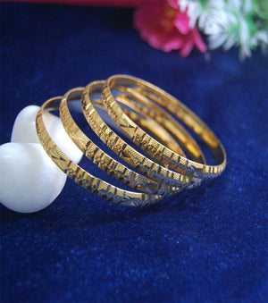 Gold plated bangles in cutting work set of 4