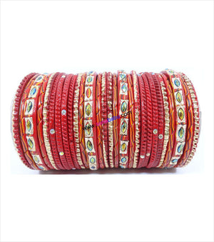 Red colored lac bangle with screw design and toned with sparkling
