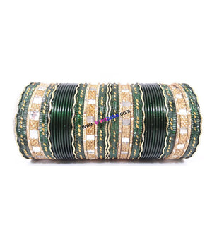 Dark green colored metal bangle with zigzag golden work