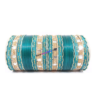 Light green colored metal bangle with zigzag golden work