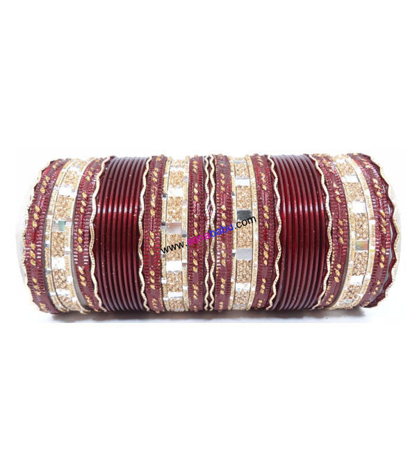 Maroon colored metal bangle with zigzag golden work