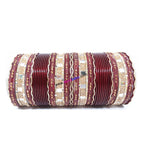 Maroon colored metal bangle with zigzag golden work