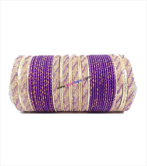 Purple and golden colored metal bangle with full work