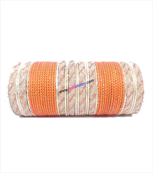 Orange and golden colored metal bangle with full work