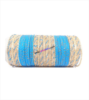 Ferozi and golden colored metal bangles with full work
